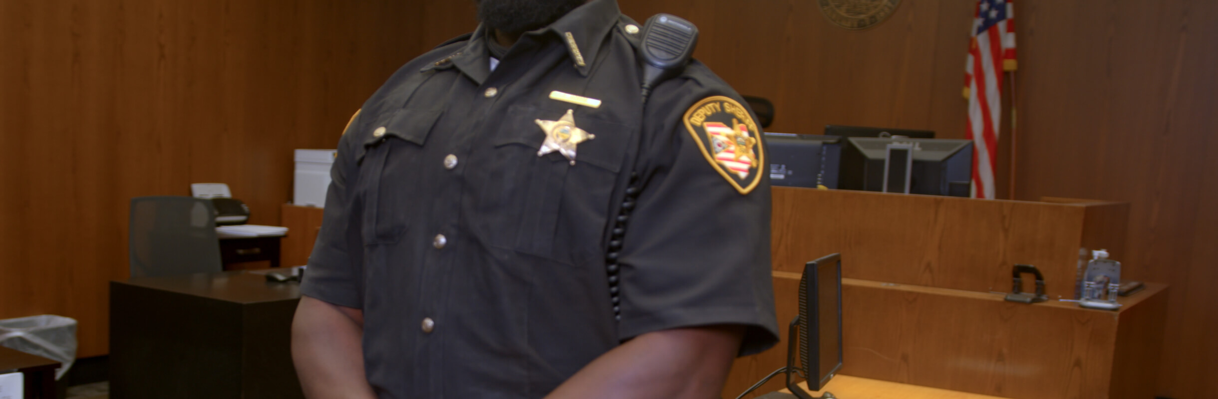 Officer in Uniform in Courtroom